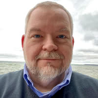 Open LinkedIn, personal website, or extended bio in a new window to learn more about